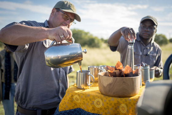 Ranger makes coffee during big five morning game drive Thornybush Game Reserve Ranger makes coffee during big five morning game drive Thornybush Game Reserve