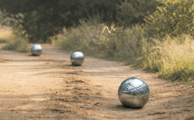 A game of boule played by a family on safari, Thornybush Game Reserve, Greater Kruger