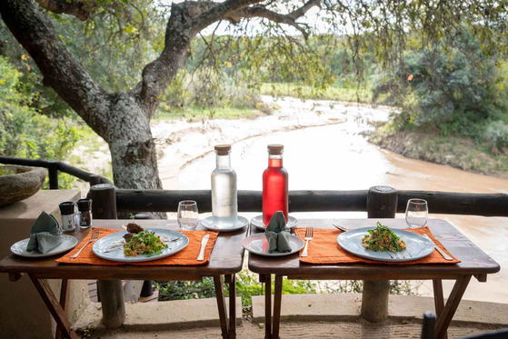 Lunch set for two overlooking the river, Shimungwe Lodge, Greater Kruger Park Lunch set for two overlooking the river, Shimungwe Lodge, Greater Kruger Park