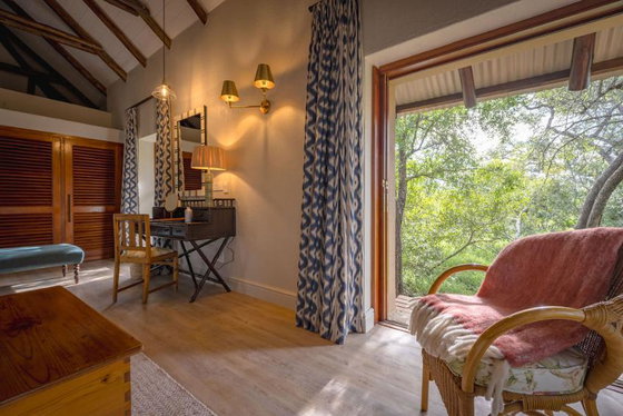 Full length glass sliding doors in a luxury safari lodge in South Africa