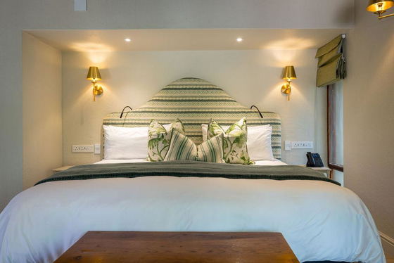 Comfortable king-size beds ready for guests in a luxury safari lodge. South Africa. Comfortable king-size beds ready for guests in a luxury safari lodge. South Africa.