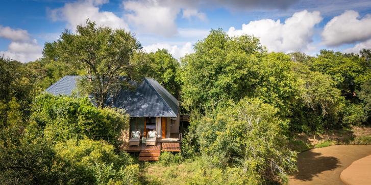Luxury safari lodge nestled in the trees on the riverbank in Thornybush Game Reserve, Hoedspruit, South Africa