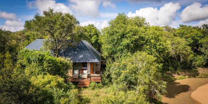 Luxury safari lodge nestled in the trees on the riverbank in Thornybush Game Reserve, Hoedspruit, South Africa
