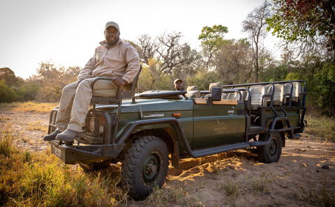 Experienced, knowledgable tracker sits on the front of the game drive vehicle, Shimungwe Lodge, Thornybush Game Reserve, Greater Kruger