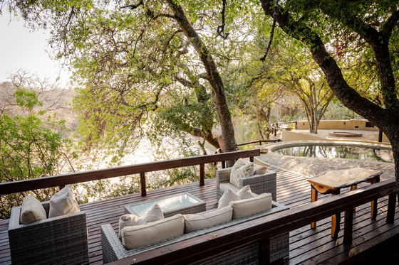 Relaxation outdoor lounge area overlooking Timbavati River, Shimungwe Lodge, Thornybush Relaxation outdoor lounge area overlooking Timbavati River, Shimungwe Lodge, Thornybush