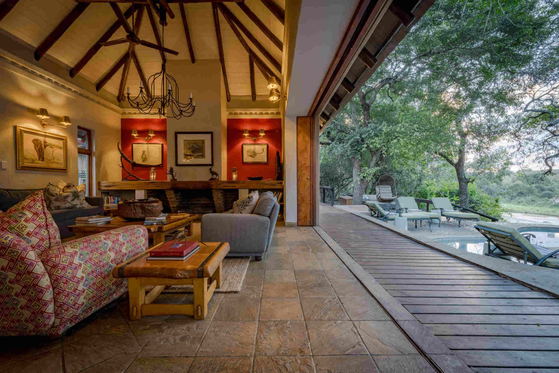 Main lounge flows to outdoor living, Shimungwe Lodge, Greater Kruger Park Main lounge flows to outdoor living, Shimungwe Lodge, Greater Kruger Park