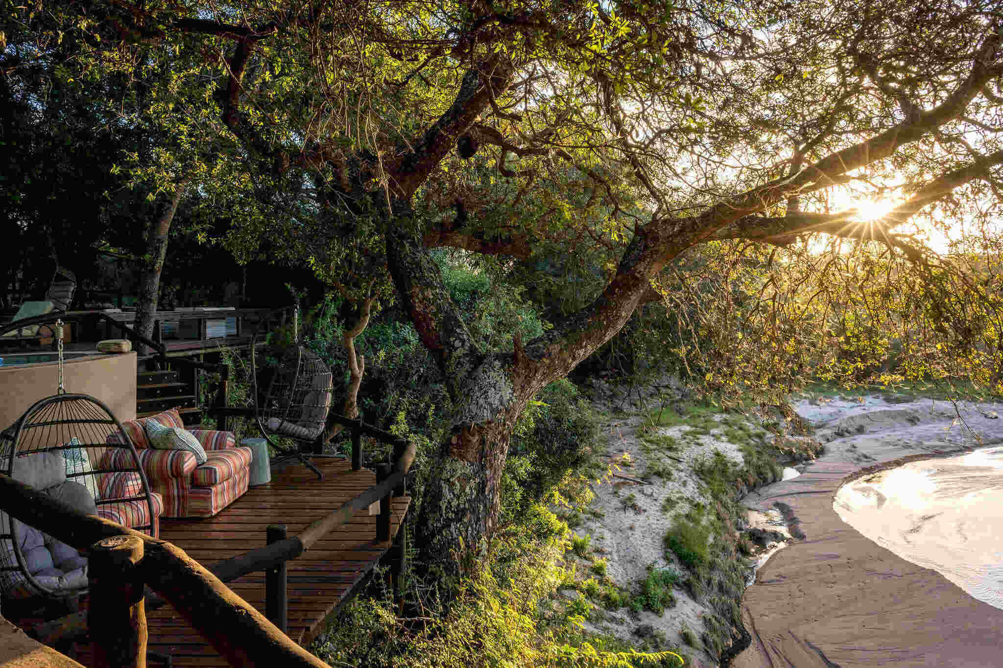 Shimungwe Lodge deck overlooking the Timbavati river in the Greater Kruger at sunset