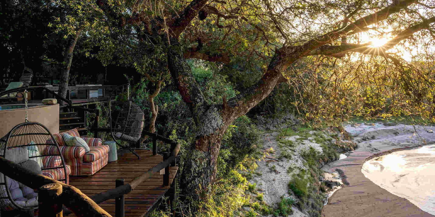 Shimungwe Lodge deck overlooking the Timbavati river in the Greater Kruger at sunset