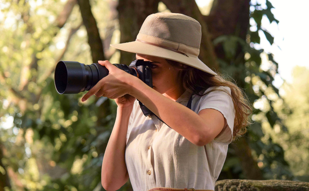 Wildlife photographer focusing her camera