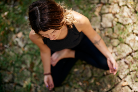 Lady immersed in a yoga session using all of her senses to enjoy a luxury safari in South Africa Lady immersed in a yoga session using all of her senses to enjoy a luxury safari in South Africa