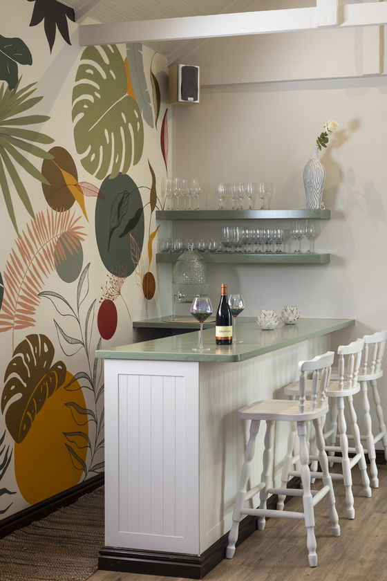 Lounge room with piano, guitar, fridge, full DSTV