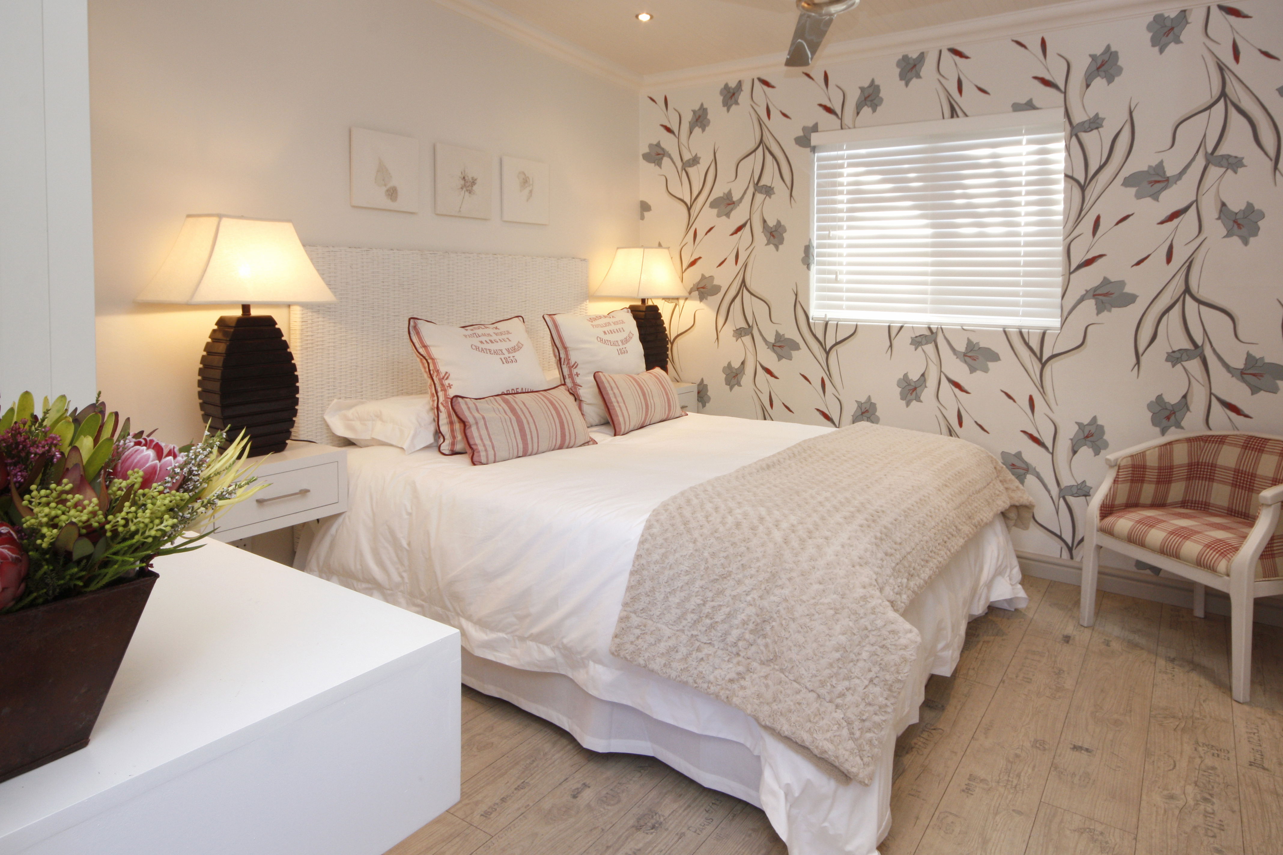 Standard Room with ensuite shower, DSTV, WIFI, tea/coffee making facilities, wall heater, ceiling fan, hot water bottles, safety deposit box, artistic hand painted walls.