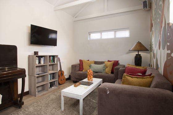 Lounge room with piano & guitar