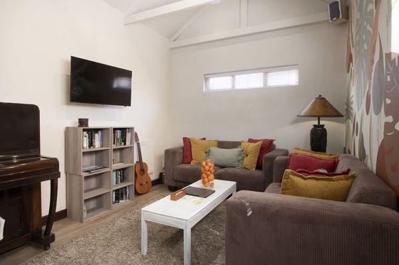 Lounge room with piano & guitar
