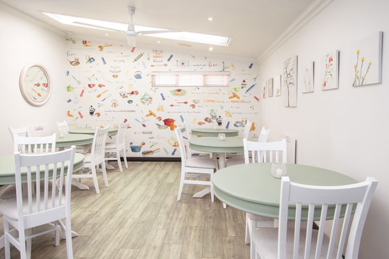 Dining room with hand painted artistic wallpaper