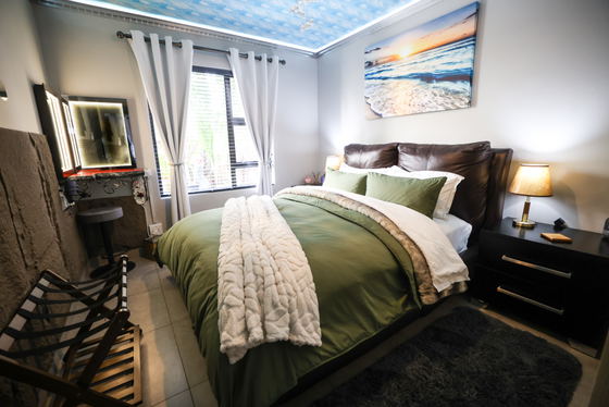 Luxury bedroom at Sunrise Apartment near OR Tambo Airport featuring a comfortable queen bed, modern interior, private accommodation in Benoni Johannesburg ideal for business travellers and couples Luxury bedroom at Sunrise Apartment near OR Tambo Airport featuring a comfortable queen bed, modern interior, private accommodation in Benoni Johannesburg ideal for business travellers and couples