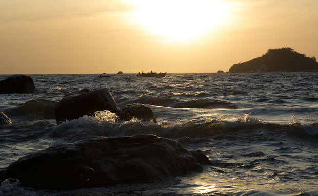 Fishermen early in the morning in senga bay on lake malawi Fishermen early in the morning in senga bay on lake malawi