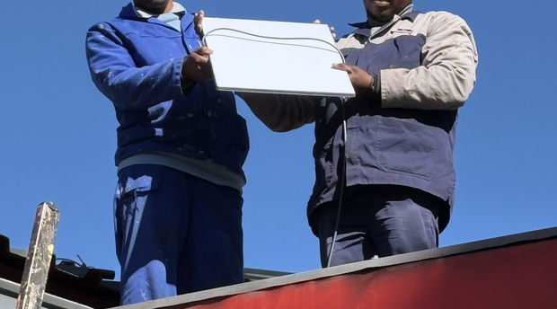 Putting up Starlink at Malealea Lodge