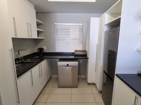 Prepare your favorite meals in our modern, fully equipped kitchens, perfect for a comfortable and convenient stay at Hermanus Luxury Accommodation, DCC Hotel Group.