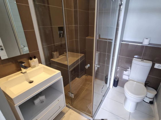 Indulge in the sophistication of our sleek tiled bathrooms, designed for comfort and elegance. Discover ultimate luxury at Hermanus Luxury Accommodation by DCC Hotel Group.