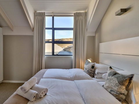 Our rooms offer the perfect blend of sophistication and comfort, providing a luxurious yet relaxing environment for your stay at Hermanus Luxury Accommodation by The DCC Hotel Group.