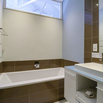 Refresh in our beautifully designed tiled bathrooms, crafted for a sleek and contemporary ambiance. Enjoy ultimate relaxation at Hermanus Luxury Accommodation by DCC Hotel Group