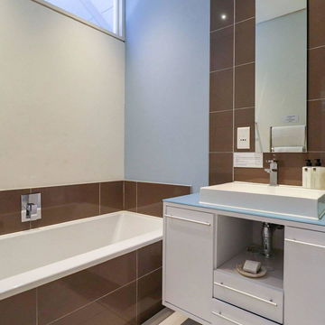 Experience spa-like relaxation in our stylish, fully tiled bathrooms, featuring contemporary finishes for a luxurious stay at Hermanus Luxury Accommodation, DCC Hotel Group.