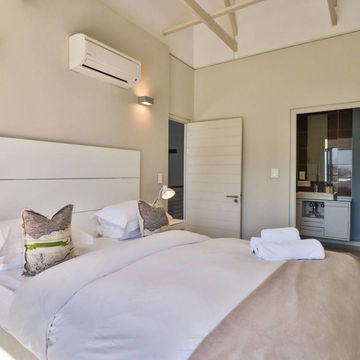 Enjoy the elegance of pristine white linens and the convenience of en-suite bathrooms, offering a serene and luxurious retreat. Discover relaxation at Hermanus Luxury Accommodation by DCC Hotel Group