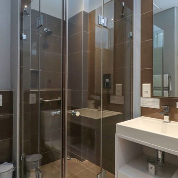 Indulge in a spa-like experience in our fully tiled bathrooms, featuring modern finishes and a shower for a luxurious and relaxing stay. Discover comfort and luxury at Hermanus Luxury Accommodation by The DCC Hotel Group.