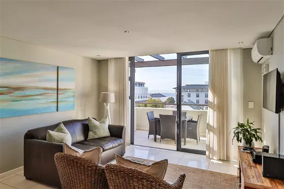 Unwind in the cozy living room of our hotel apartment, where comfort meets a relaxing ambiance. Experience the ultimate in luxury and relaxation at Hermanus Luxury Accommodation by DCC Hotel Group