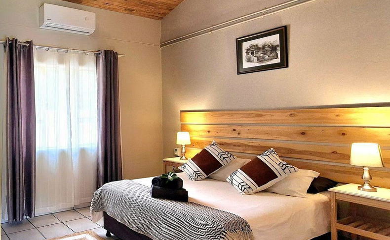 Air-conditioned bedroom offering comfortable and relaxing accommodation near Kruger National Park. Air-conditioned bedroom offering comfortable and relaxing accommodation near Kruger National Park.