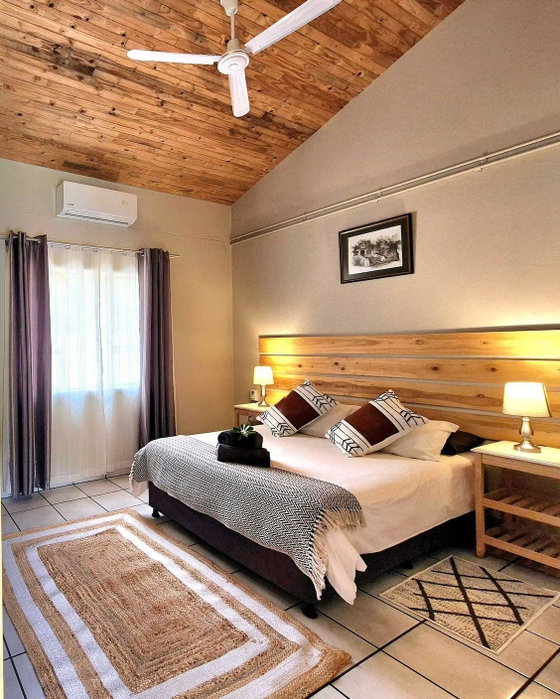 Air-conditioned bedroom offering comfortable and relaxing accommodation near Kruger National Park.