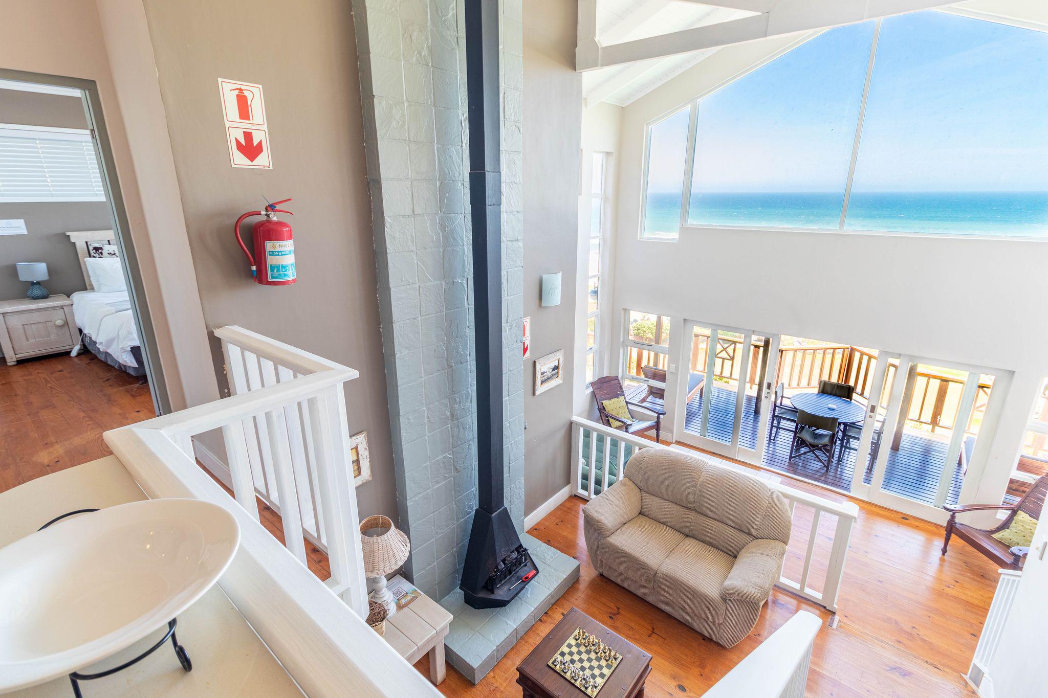 Holiday home interior in Wilderness with a wall-mounted fire extinguisher
