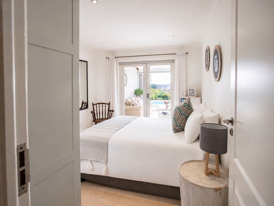 View from the first bedroom towards the veranda lounge and pool