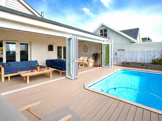 Two lounges on the veranda beside the pool deck