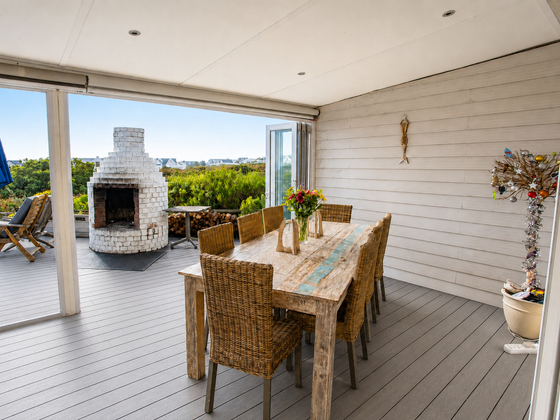 Dining table set on the veranda at Elevate Grotto Bay