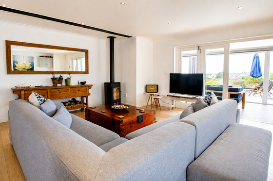 Elevate Grotto Bay — indoor TV lounge with fireplace
