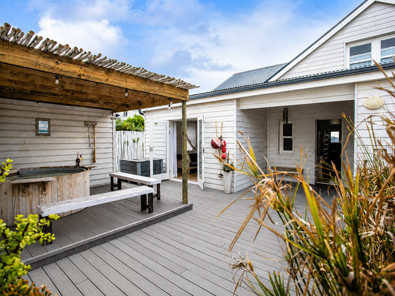 Hot tub in the private courtyard beside the second bedroom entrance