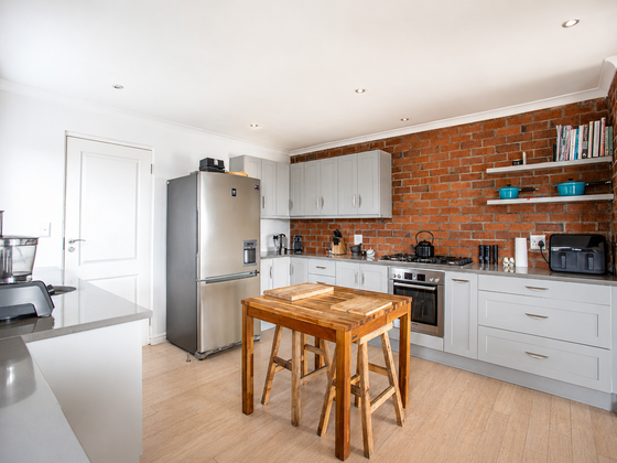 Open-plan kitchen at Elevate Grotto Bay, fully equipped for self-catering