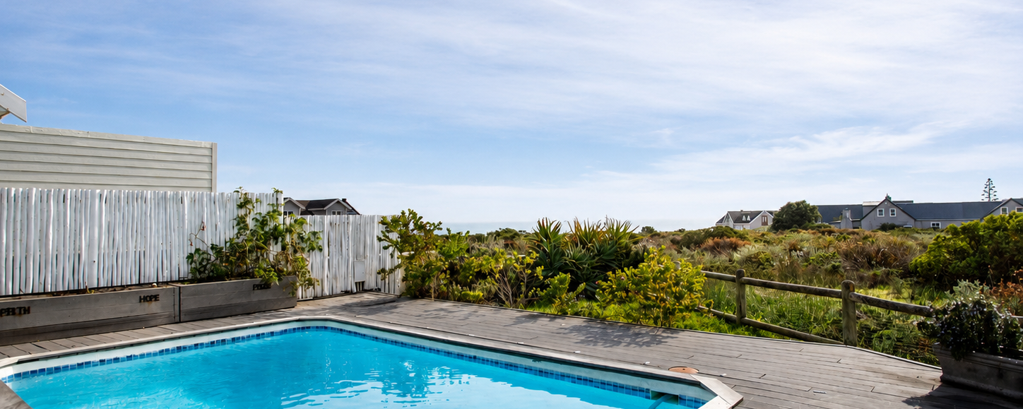 Private swimming pool surrounded by fynbos