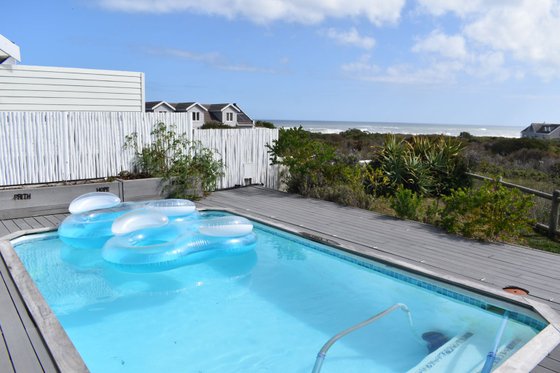 Pool deck with fynbos and sea view