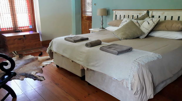 Fireplace Room with garden and swimming pool view, bed and breakfast accommodation with swimming pool, yellowwood floors, historic house, family suite, family friendly, child friendly Fireplace Room with garden and swimming pool view, bed and breakfast accommodation with swimming pool, yellowwood floors, historic house, family suite, family friendly, child friendly