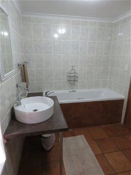 Another photo of Stone's bathroom (bath, shower, toilet and basin)