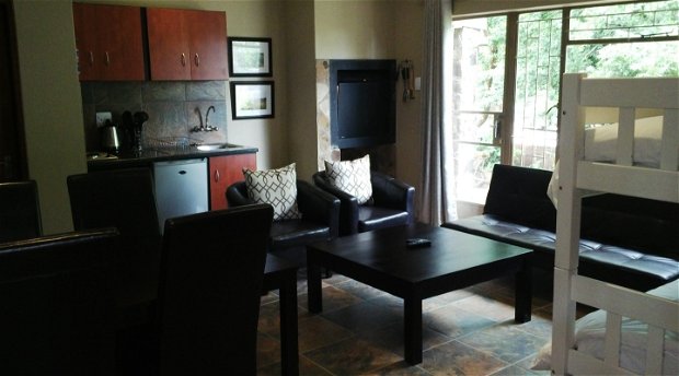 Super king studio lounge and dining area - Treelands Abbey Dullstroom Super king studio lounge and dining area - Treelands Abbey Dullstroom