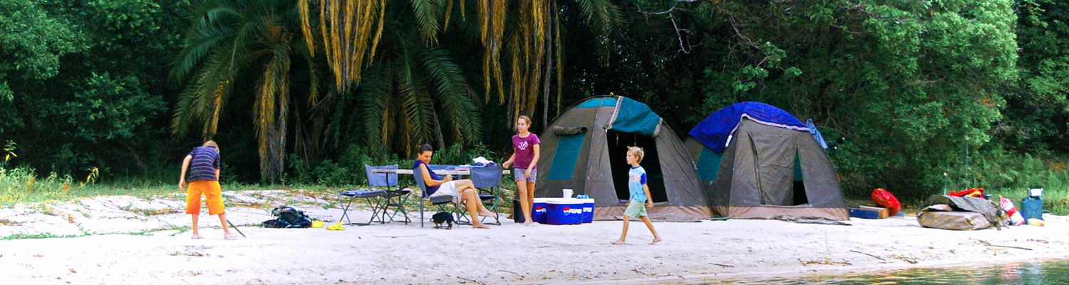 Family camping on an island in the Zambezi River, Zambia