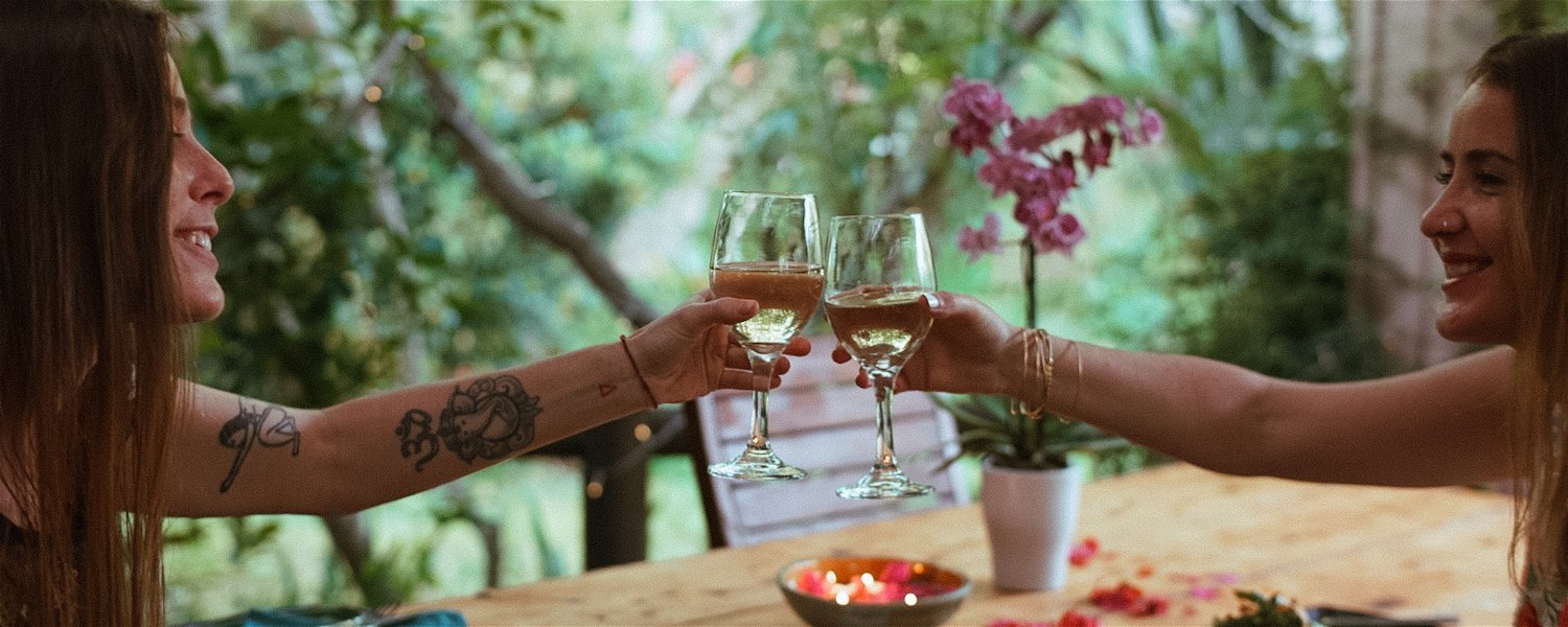 enjoy an organic vegan glass of wine with a delicious Secret Dinner at Peace of Eden Vegan Lodge and Retreat Centre in Knysna, Garden Route