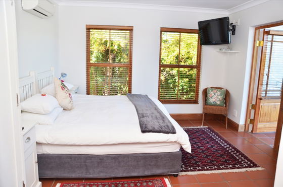 King bed air conditioning satellite television white linen