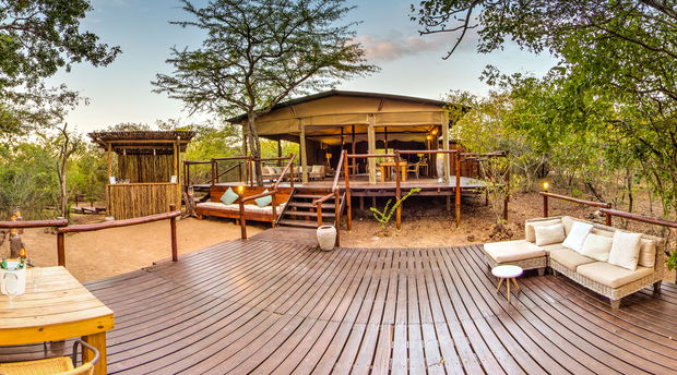 view of the main lodge area at Ngama Tented Safari Lodge with indoor and outdoor seating