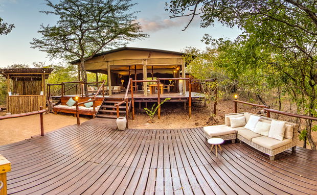view of the main lodge area at Ngama Tented Safari Lodge with indoor and outdoor seating