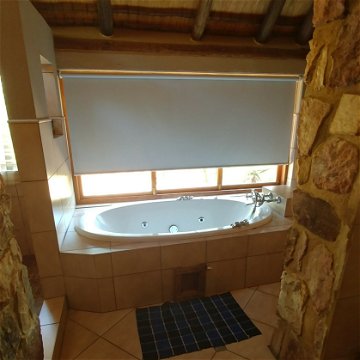 Red Sky Lodge - Lower west spa bath, with roll down blind if nececessary